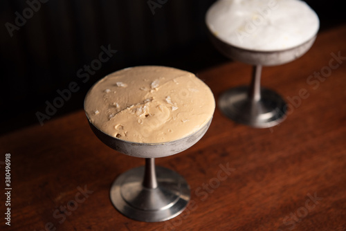 Two ice cream servings in stainless steel dish photo