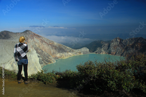 A woman standing at the top of mount Ijen Banyuwangi East Java Indonesia