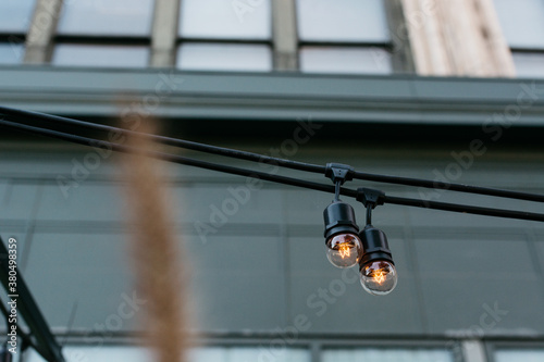 Decorative incandescent light bulbs in front of a building