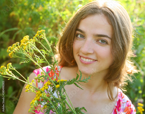 young woman and wild flowers.