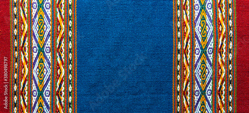 Traditional design of sheep and alpaca wool textile in the local art and craft market of Cusco, Peru.