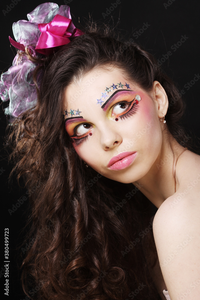Naklejka premium Beautiful lady with artistic make-up.
