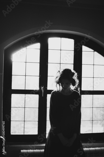 Darkish portraits of a girl in black and white photo