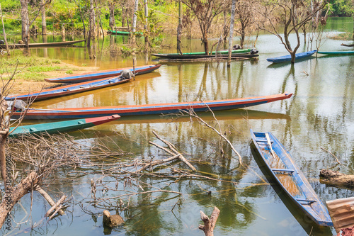 Small boats park on the bank of Ngum River at Vientiane, Laos