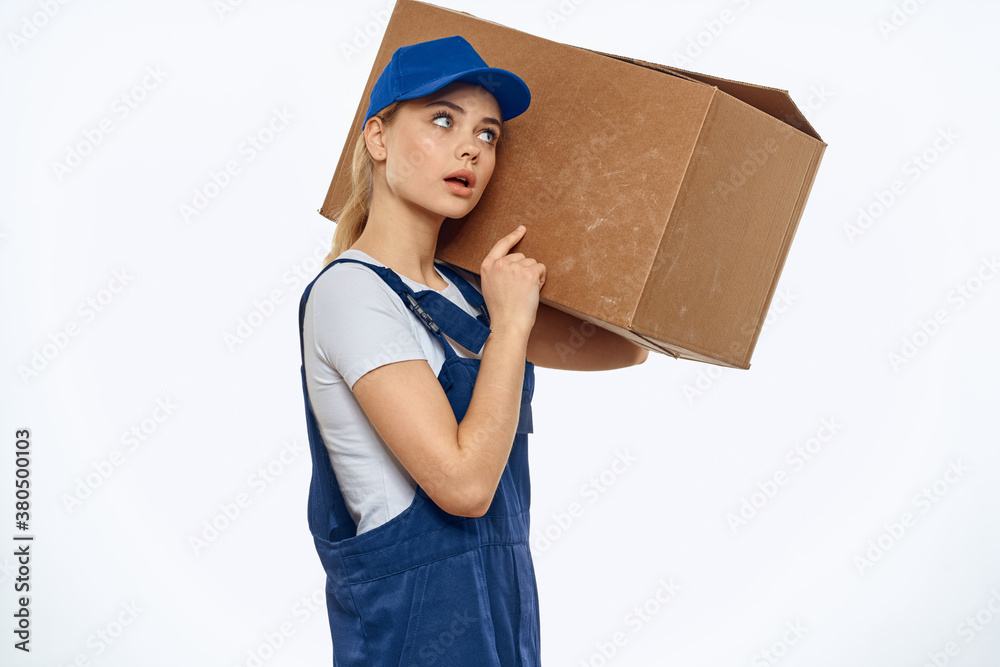 Woman working uniform box in hands packing service light background Woman working uniform box in hands packing service light background