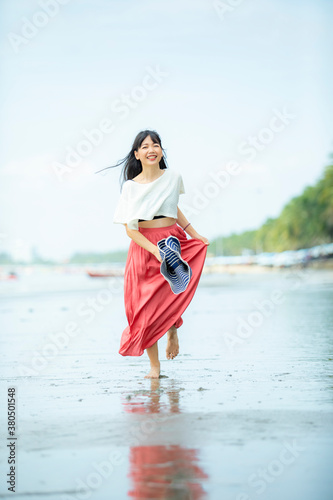 portrait asian younger woman happiness on vacation sea beach