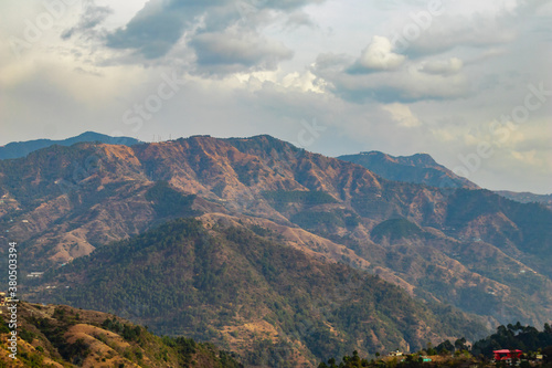 wide shot of mountains and cloudy sky in the background, beauty concept.