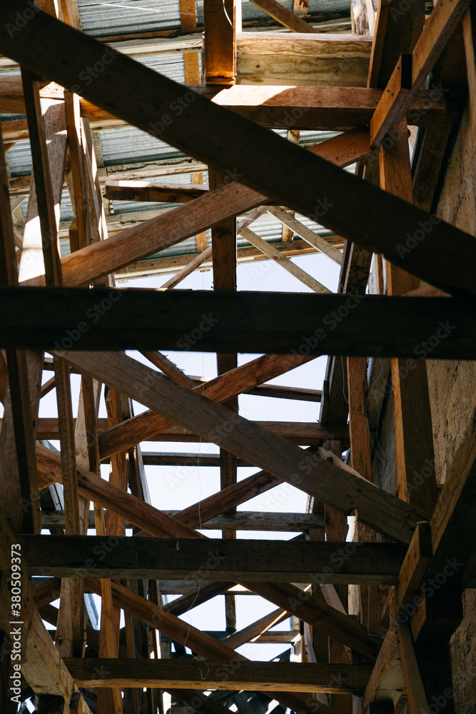 A structure of wooden scaffolding on a sunny day A structure of wooden scaffolding on a sunny day