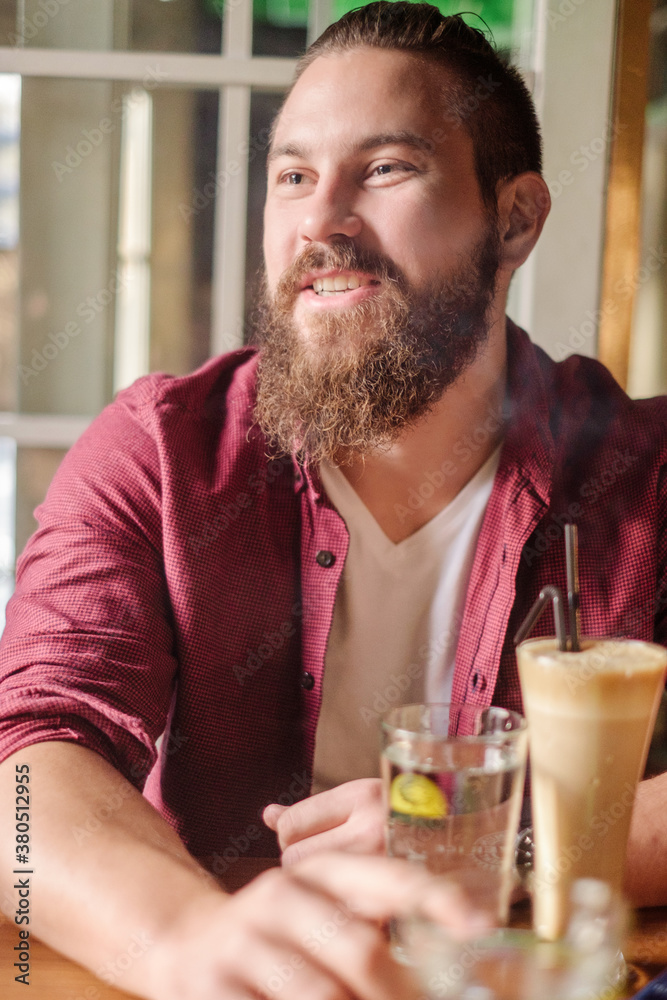 Handsome Bearded Man Sitting at the Cafe Handsome Bearded Man Sitting at the Cafe