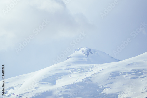 big Elbrus mountain in summe on cloudy day photo