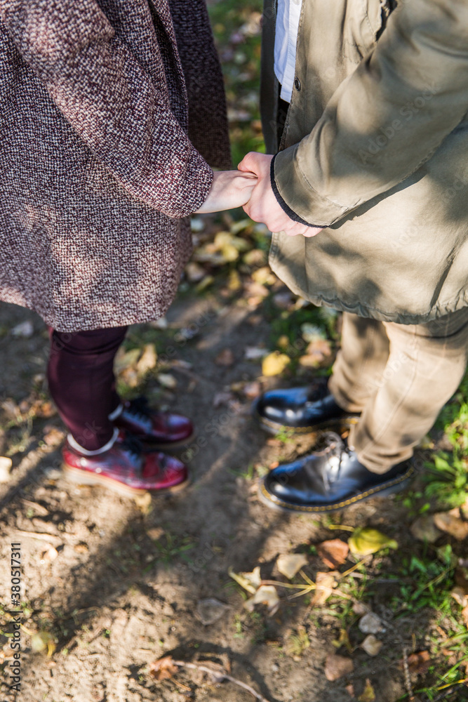Young couple in love holding hands Young couple in love holding hands