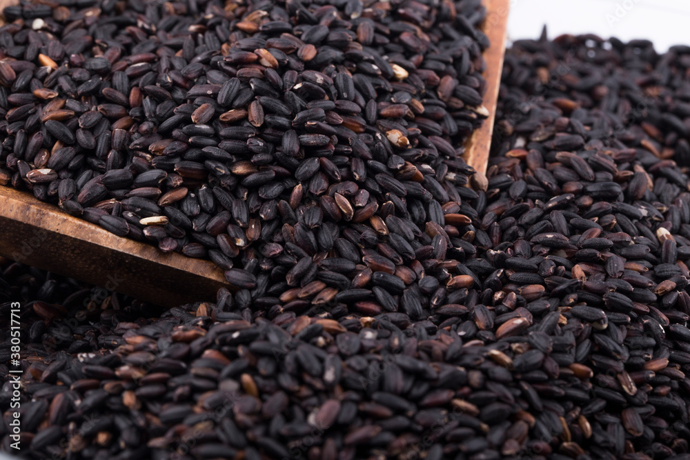 Close up background view of organic black purple rice. Close up background view of organic black purple rice.