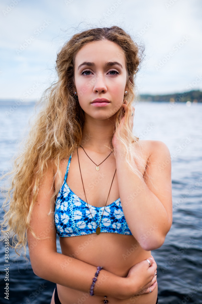 Beautiful young woman wearing bikini on the lakeside Beautiful young woman wearing bikini on the lakeside