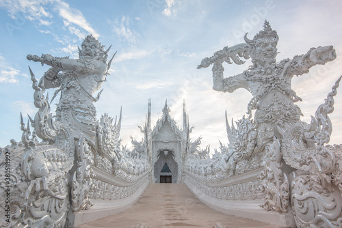 Outside photo of Wat Rong Khun Commonly known as the White Temple, a cultural attraction Famous and attention of tourists In Chiang Rai, Thailand