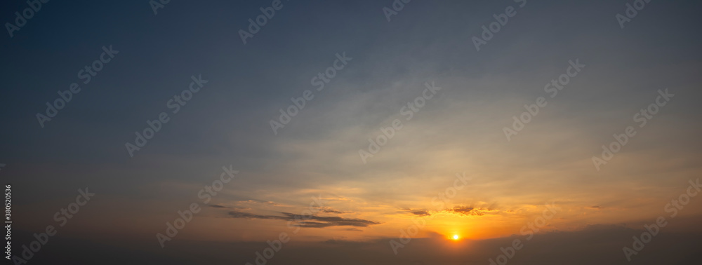 Beautiful sky and dark clouds, Gorgeous panorama scenic of the sunrise with silver lining and cloudy on the orange and blue sky background.