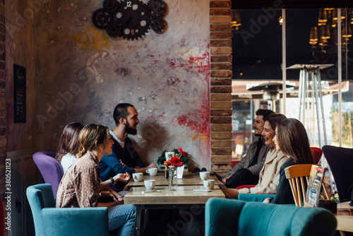 Friends having a casual meeting in the cafe