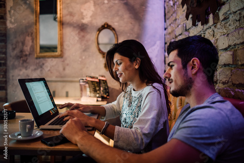 Man and woman working in the cafe