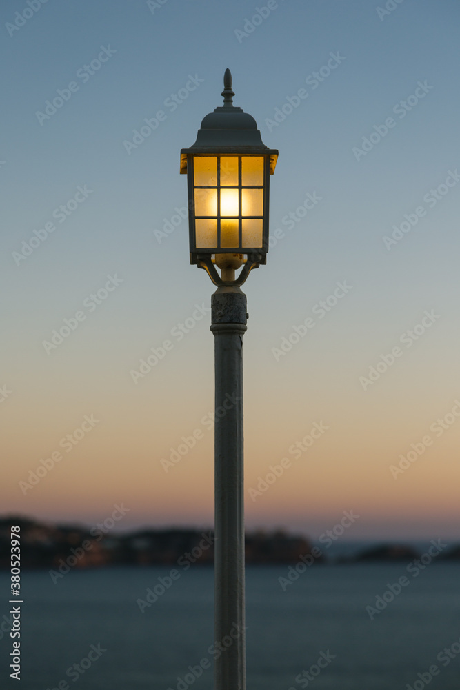 Street Lamp at Dawn with the Mediterranean Sea at Background Street Lamp at Dawn with the Mediterranean Sea at Background