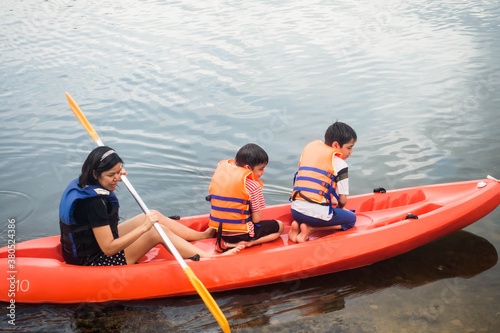 Family rowing kayak boat nature travel trip