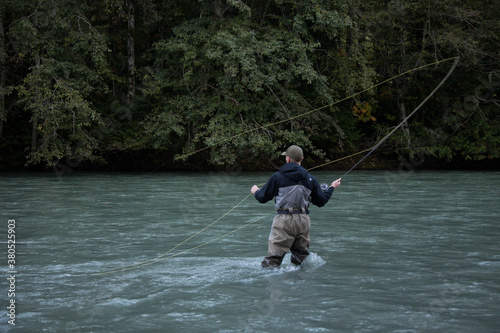Squamish, British-Columbia / Canada - 09/23/2020: A Fly Fisherman casts his line for a fish on the Squamish River