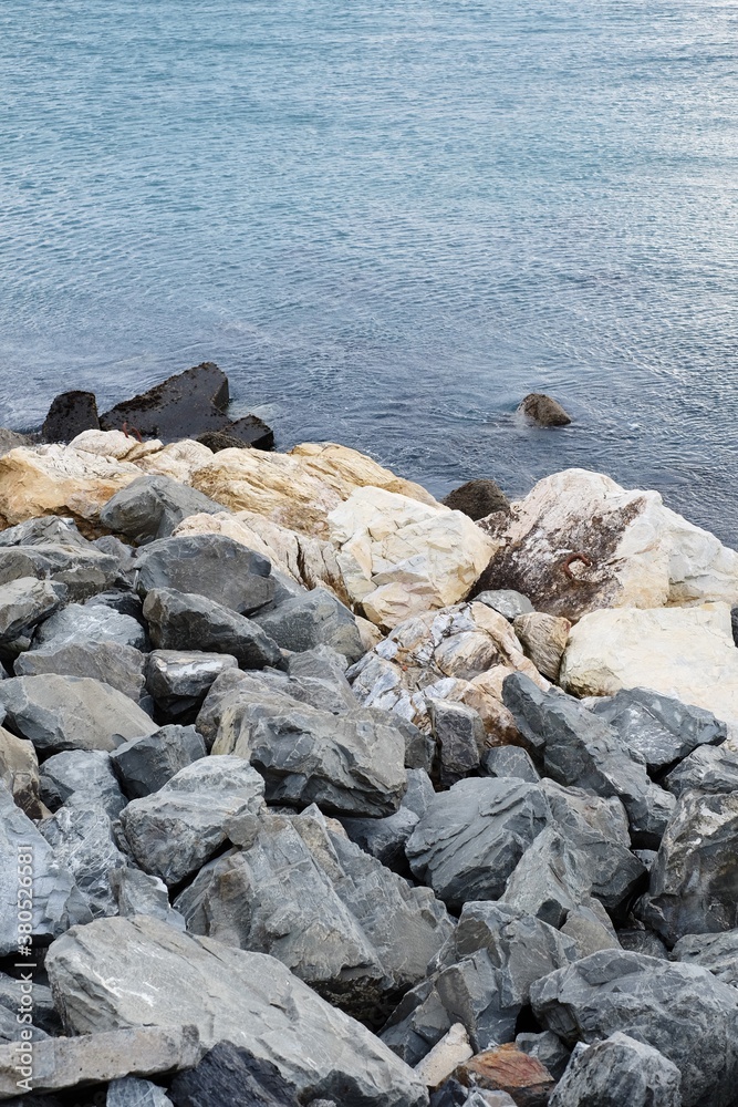 A pile of rocks on a seashore