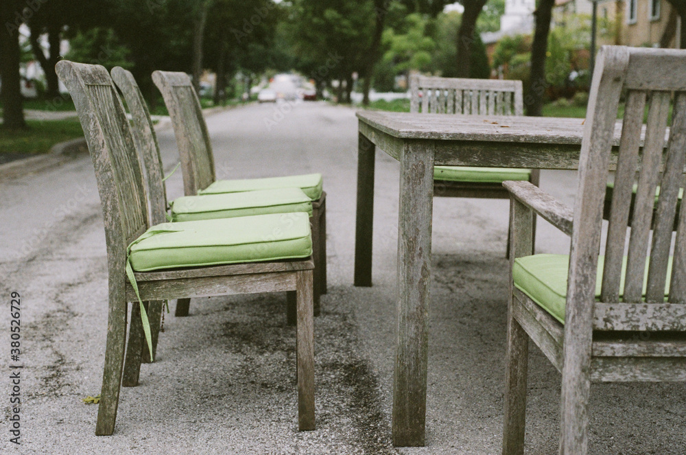 Picnic table and chairs in the middle of a street