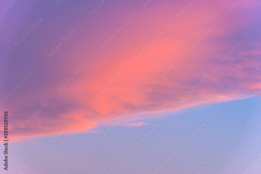 A soft and warm cloud sky with pink, orange purple, and blue hues A soft and warm cloud sky with pink, orange purple, and blue hues