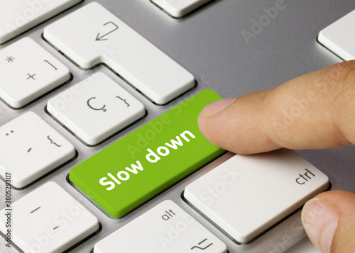 Slow down - Inscription on Green Keyboard Key.