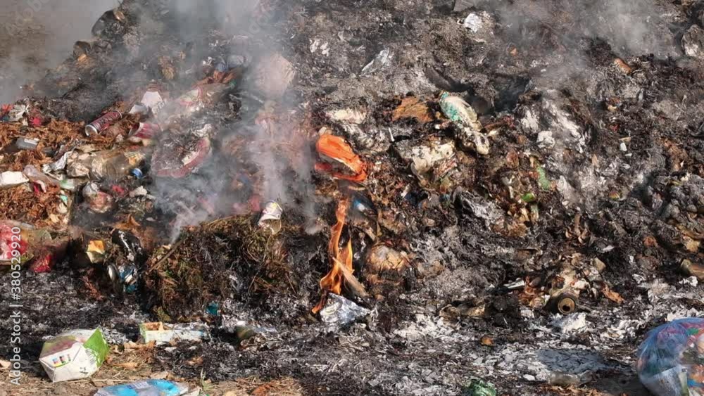 Smoldering garbage at a dump in the city. Smoldering garbage at a dump in the city.