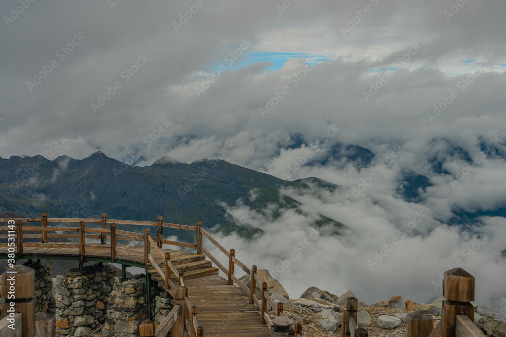 Obraz premium The mountain landscape with clouds around in Dagu glacier park in Sichuan, China.