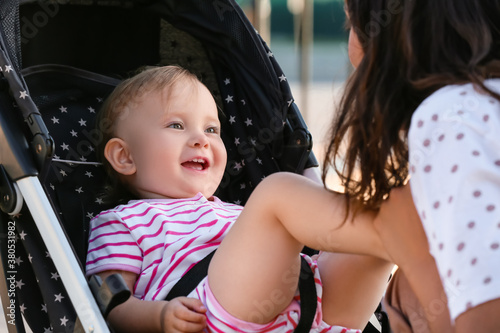 Happy baby girl laughing in...