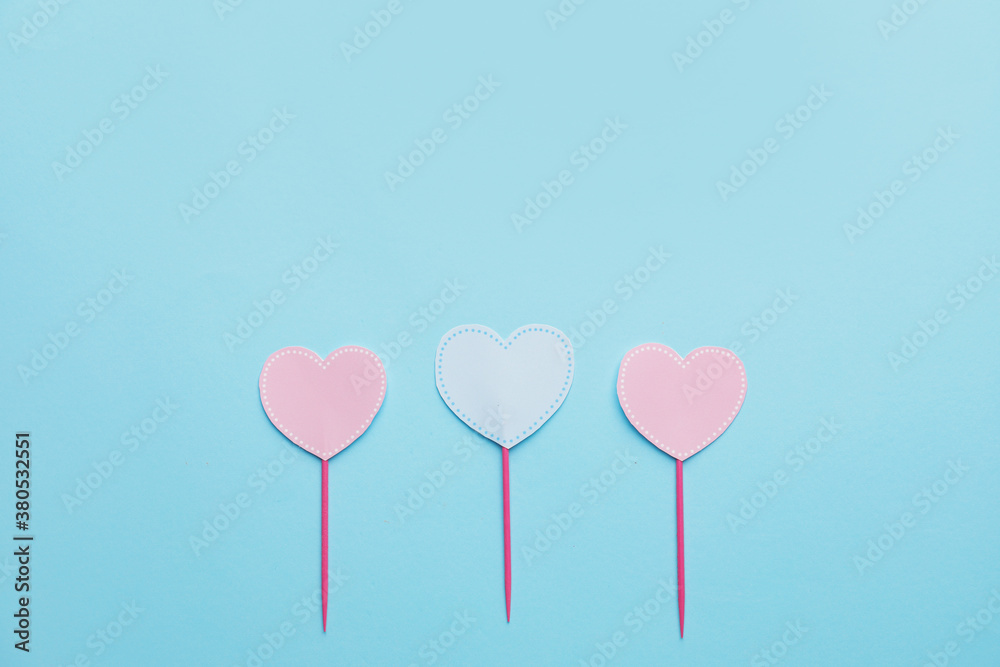 Stylish cupcake toppers on color background