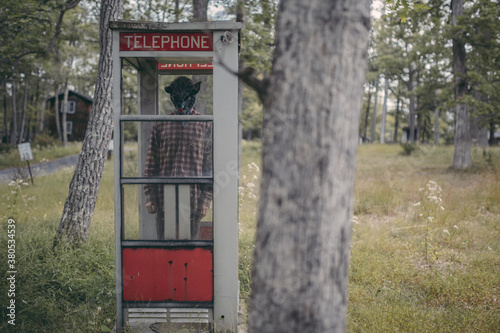 Creepy Abandoned Resort Man With Mask in Phone Booth