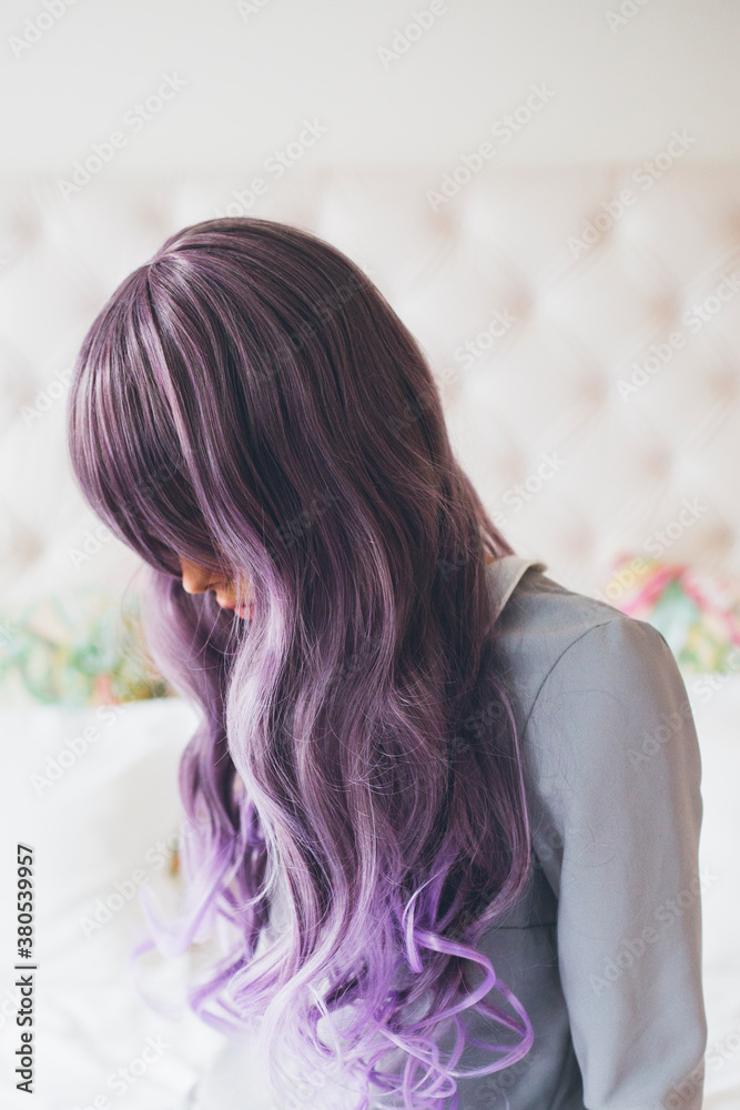Fashionable young woman with purple hair portrait Fashionable young woman with purple hair portrait