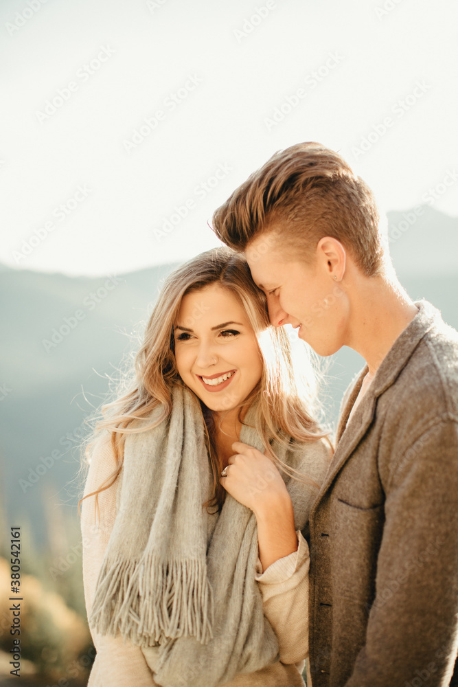 Young engaged couple exploring mountain side roads Young engaged couple exploring mountain side roads
