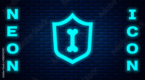 Glowing neon Animal health insurance icon isolated on brick wall background. Pet protection concept. Vector.