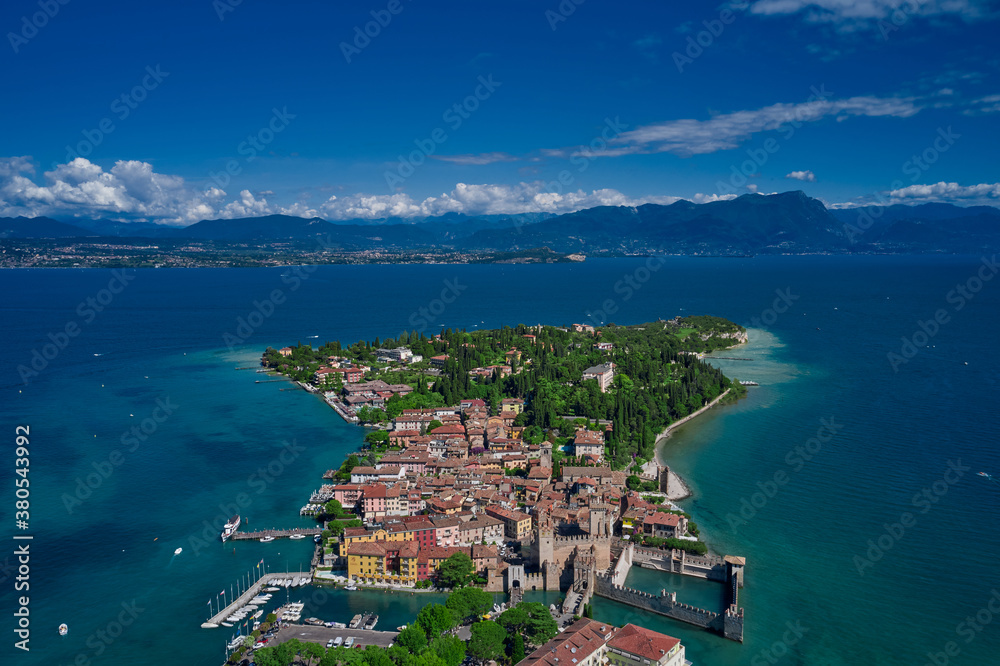 Aerial view at high altitude on Sirmione sul Garda. Italy, Lombardy.Rocca Scaligera Castle in Sirmione.