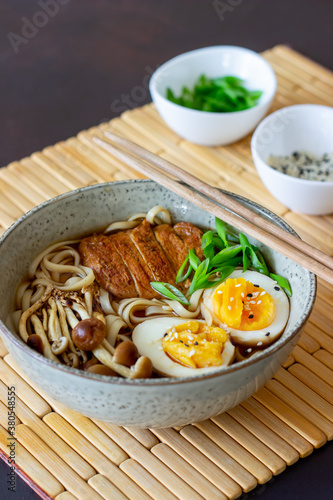 Ramen soup with noodles  pork  mushrooms and eggs. Japanese cuisine. Recipe.