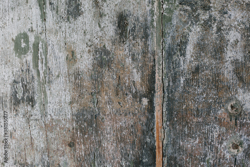 Grungy discolored wooden door texture photo