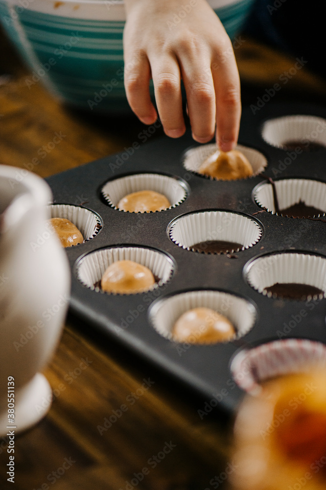 Mother and Son making Almond Butter Chocolate Cups Mother and Son making Almond Butter Chocolate Cups