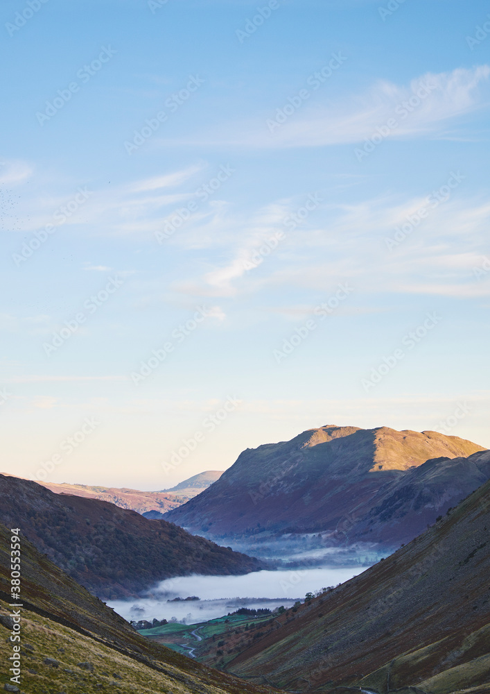 Fog formed in the valley at sunrise. Kirkstone Pass, Cumbria, UK. Fog formed in the valley at sunrise. Kirkstone Pass, Cumbria, UK.
