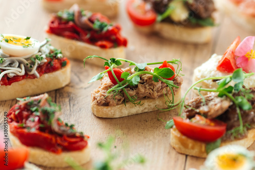 Assorted spanish tapas with different toppings