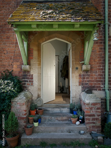 Front door for an understated Hipster Red brick English country House photo