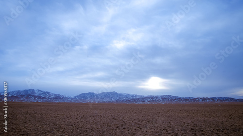 Cloudy sky during winter over Altai mountain range in Govi-Altai province, Mongolia.
