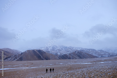 Friends are walking on the slop in Altai mountain area, Govi-Altai province, Mongolia. photo