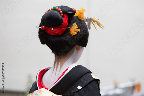 Fotografia, Obraz A traditional geisha out and about walking in Gion Kyoto Japan .
