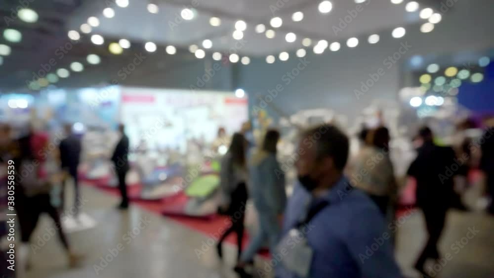 Blurred Background flow of many people inside space shopping center. Blurred Background flow of many people inside space shopping center.