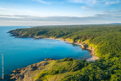 Aerial panoramic view of picturesque coastline with sand beaches, rocks and green forests on the southern Black Sea coast, Bulgaria.