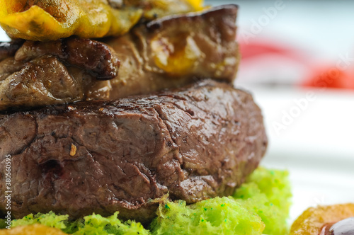 grilled minien steak with vegetables in a beautiful author's serving ultra macro
