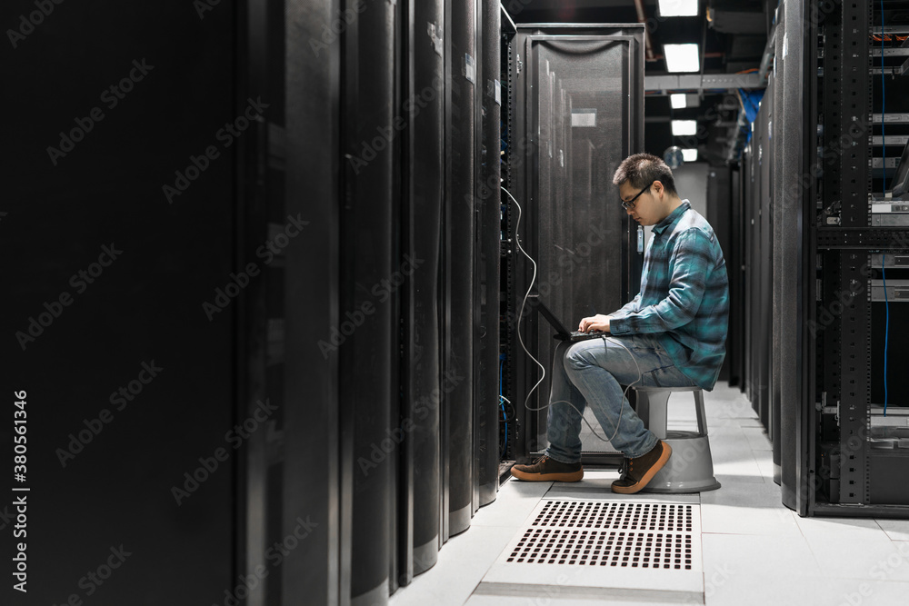 Young engineer working in datacenter Young engineer working in datacenter